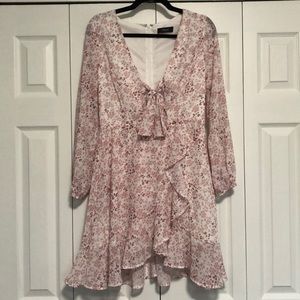 Long sleeve pink and white dress with cut out in front